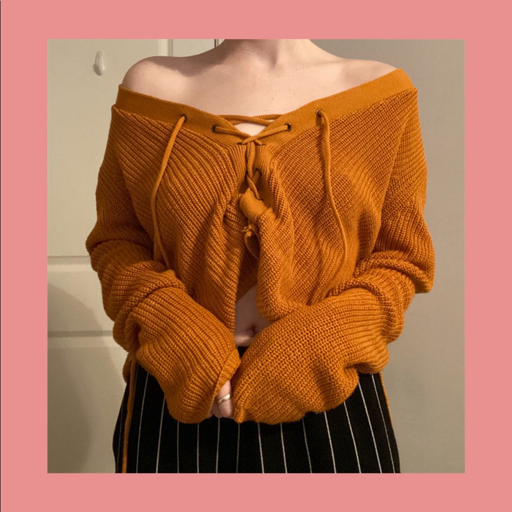 Slouchy orange-yellow lace-up sweater